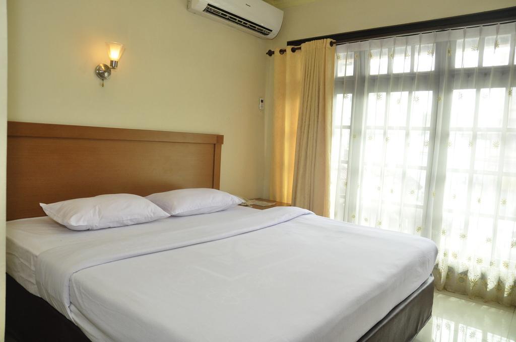 Hotel Andhika Syariah Samarinda Habitación foto