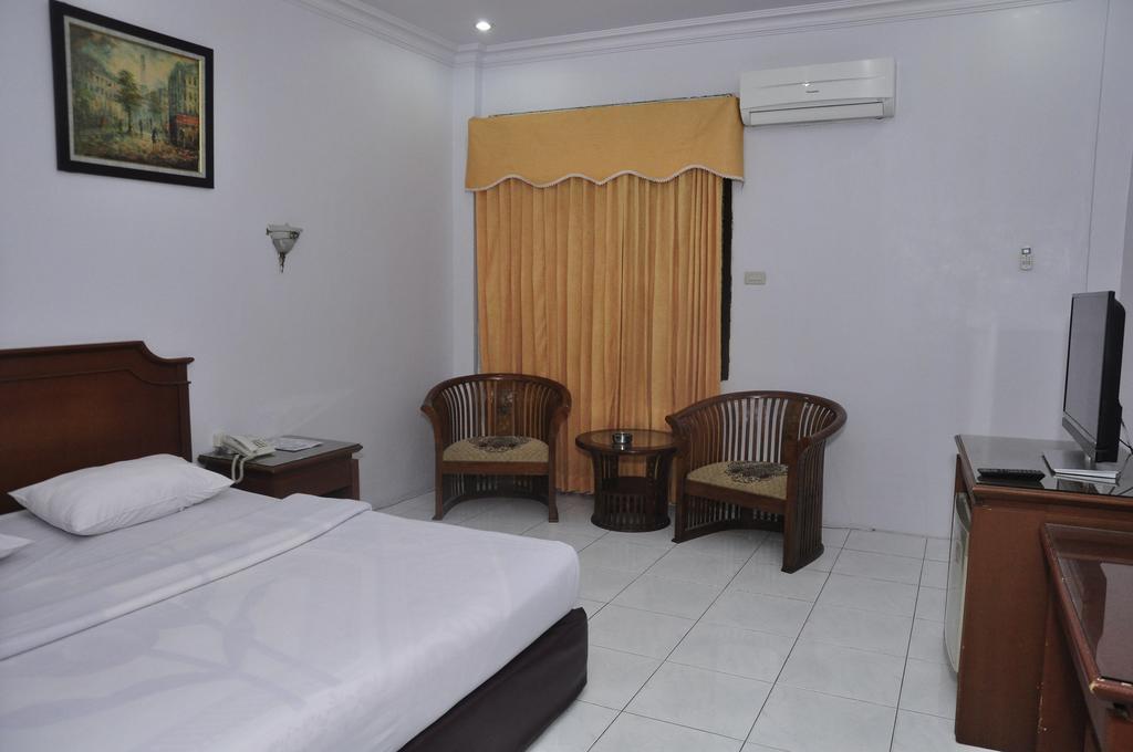 Hotel Andhika Syariah Samarinda Habitación foto